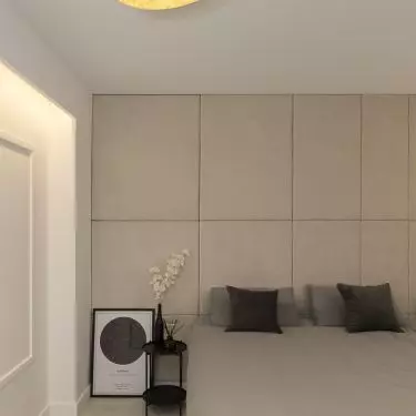 The focal point of the bedroom is the large bed