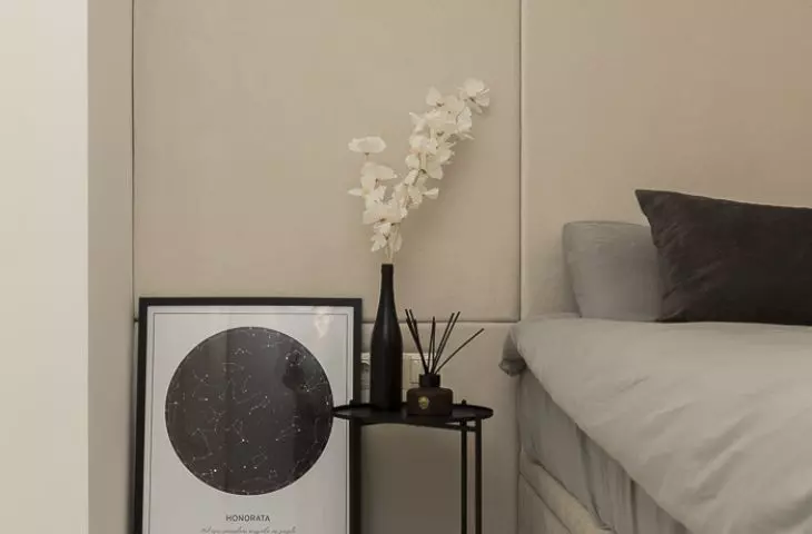 Black bedside tables are a functional addition
