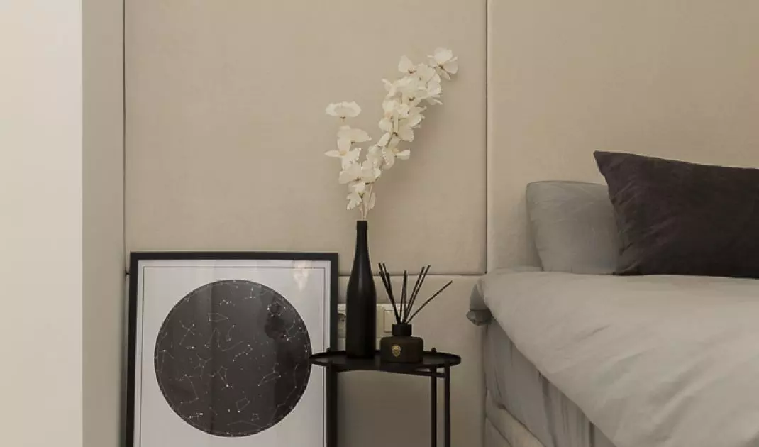 Black bedside tables are a functional addition