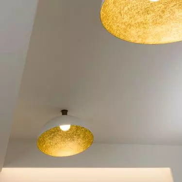 The gold interior of the lamps adds a touch of elegance to the arrangement