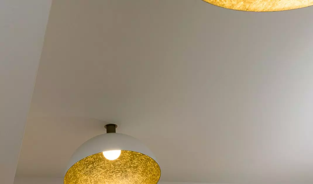 The gold interior of the lamps adds a touch of elegance to the arrangement