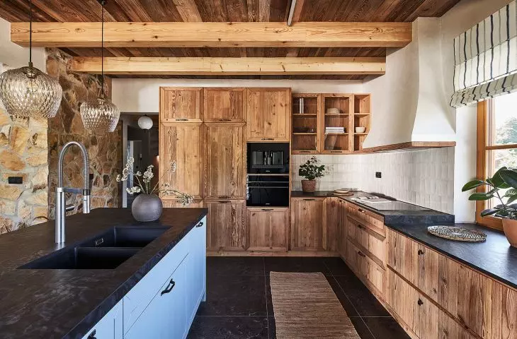 The kitchen cabinetry was created from aged, demolished pine