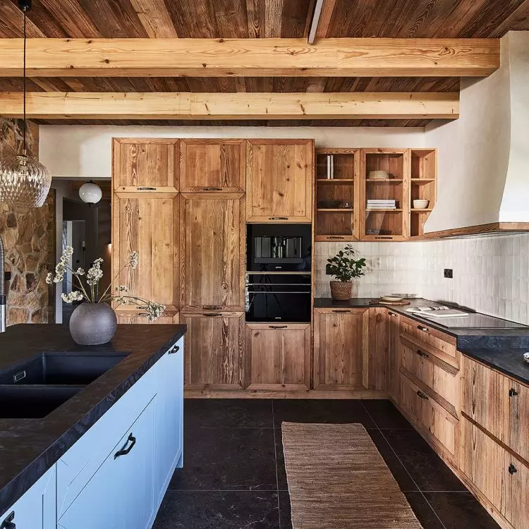 The kitchen cabinetry was created from aged, demolished pine
