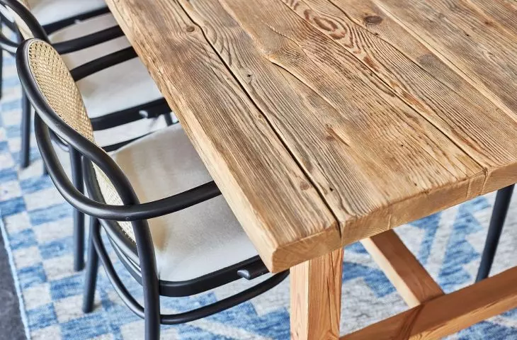 The table was created from the face of a beam that was part of the facade of an old cottage