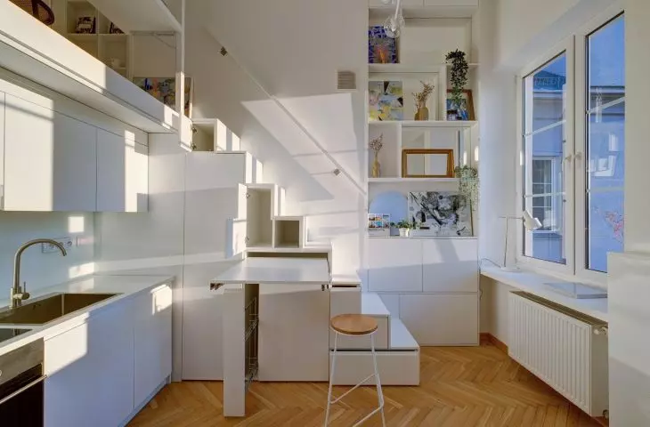 It's worth looking for a functional solution to utilize the space under the stairs
