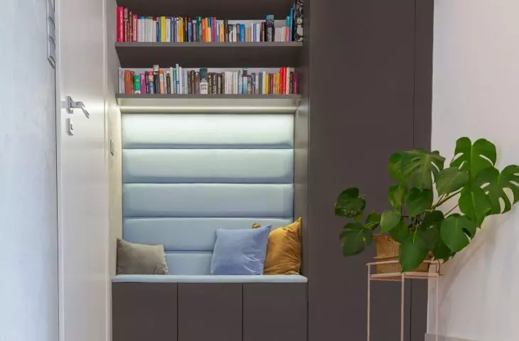 The space under the stairs is a great space for a bookcase