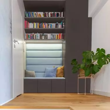 The space under the stairs is a great space for a bookcase