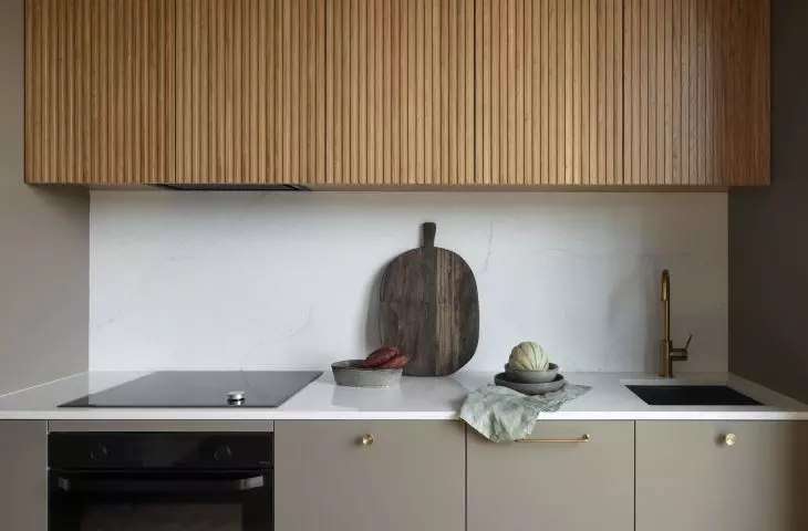 The fronts of the upper cabinets of the development were made of fluted veneer 