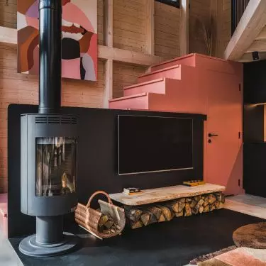 You can even put a fireplace under the stairs