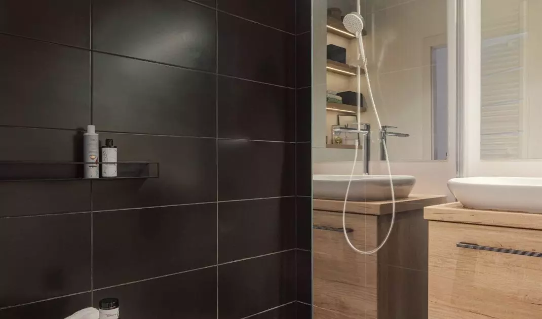 The bathroom floor was tiled with ornamental tiles