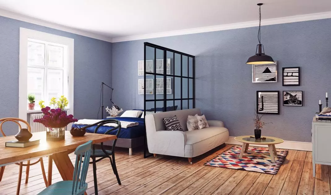 You can divide a small interior with mobile partitions or screens. Choose light or semi-transparent materials that will not overwhelm the room 