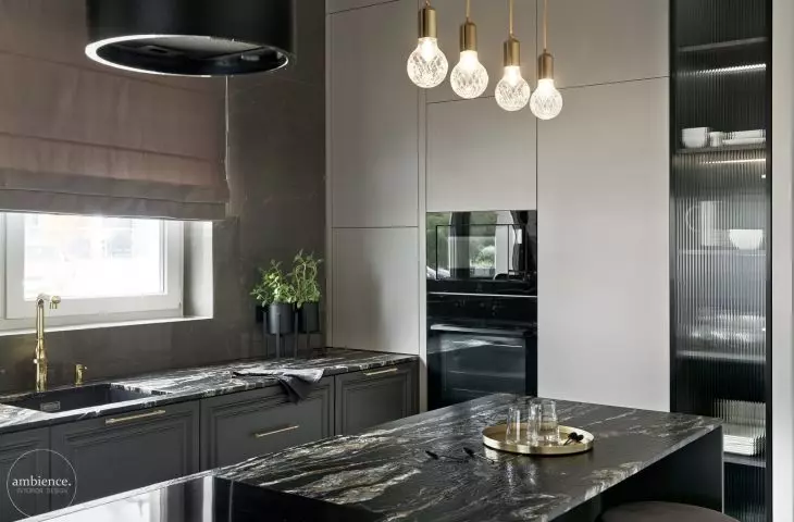 The kitchen is dominated by dark colors