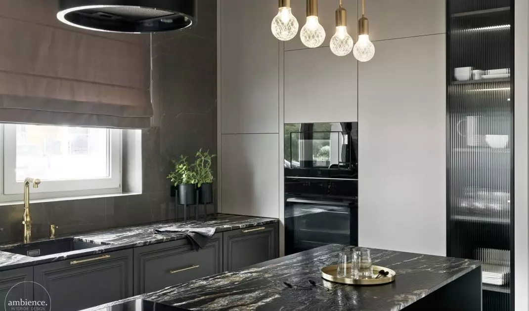 The kitchen is dominated by dark colors