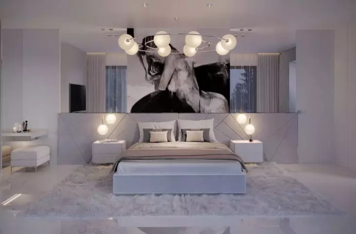 The wall behind the bed was decorated with upholstered panels and graphics