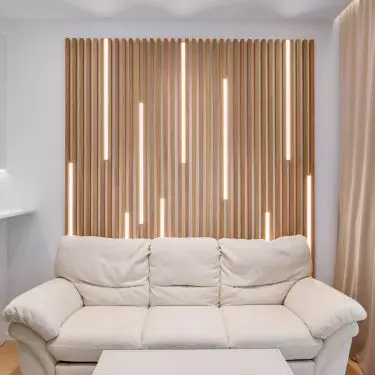 The decoration behind the sofa refers to a Norwegian forest