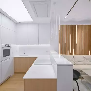 The arrangement is dominated by a combination of white and light wood