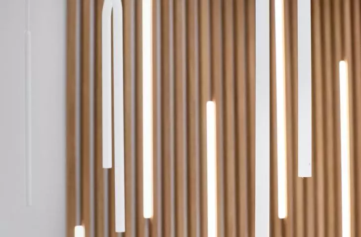 The laths are interspersed with LED lighting