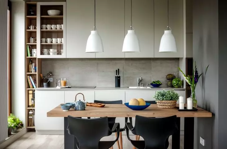 The kitchen is dominated by grays