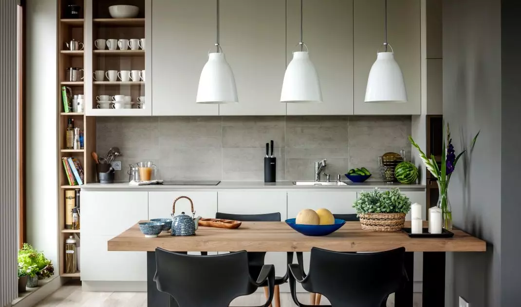 The kitchen is dominated by grays
