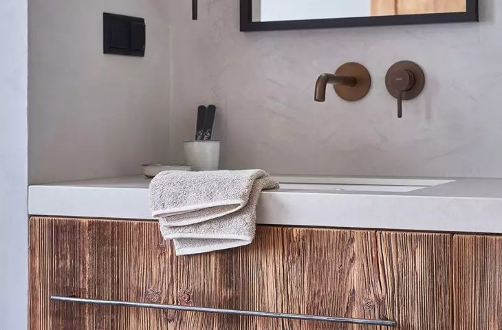 The chest of drawers was created from recycled wood