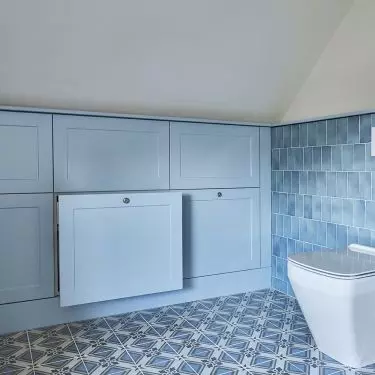 The bathroom also has blue built-ins