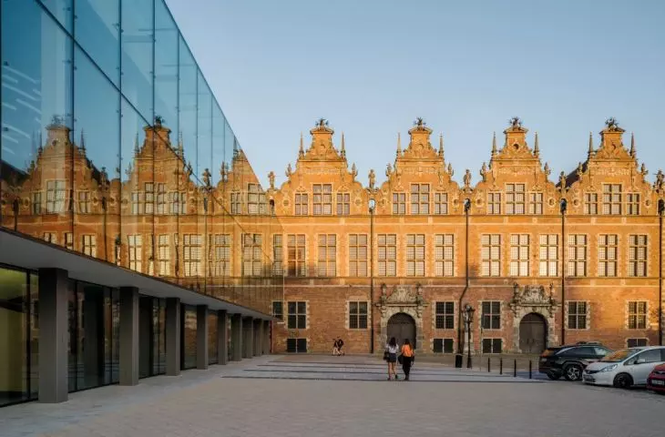 Facade of the Coast Theater and view of the Grand Armory 
