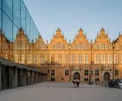 Facade of the Coast Theater and view of the Grand Armory 