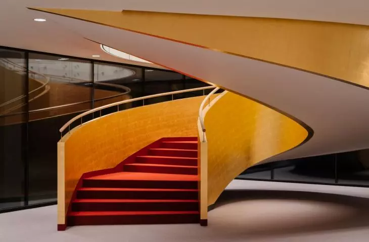 The interior intertwines red and gold