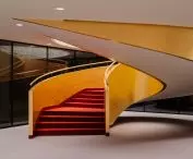 The interior intertwines red and gold