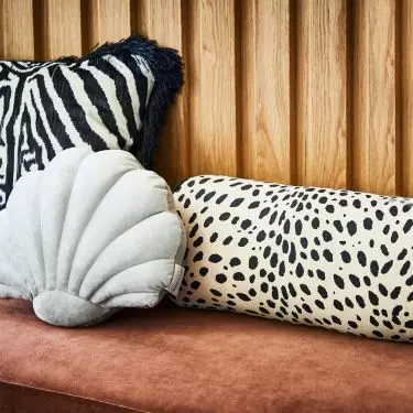 Introduce bold patterns with textiles