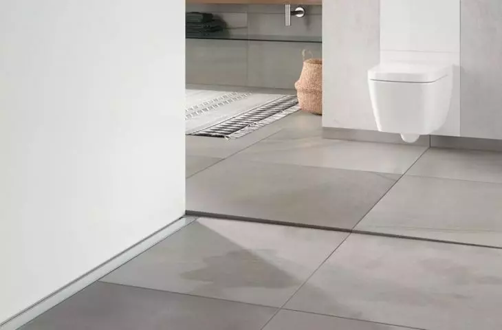 In a walk-in shower, a linear drain, a wall-mounted drain, as well as tiles with a built-in drain will work.