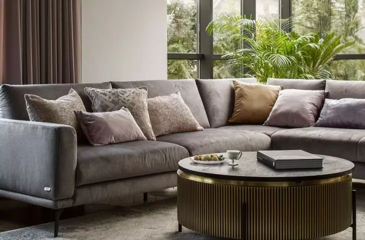 The comfortable corner is located next to large windows
