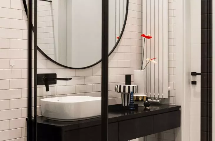 White bathroom features contrasting furnishings