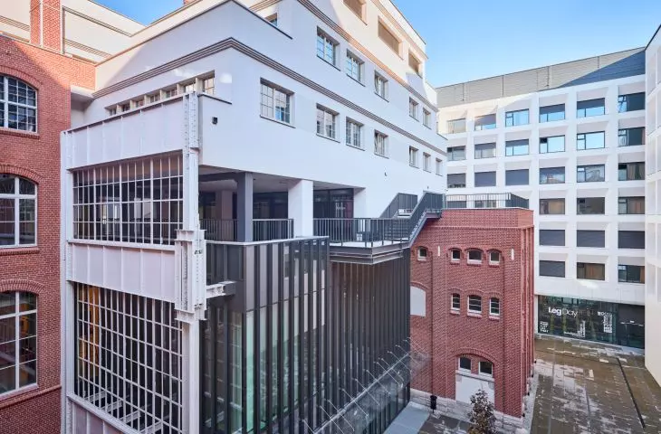 The new wings have seven floors above ground, housing student and hotel rooms