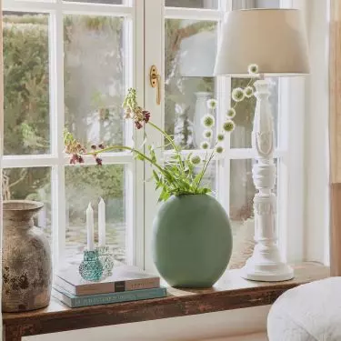 Plants will give the arrangement a natural feel