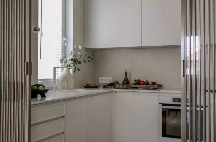 The kitchen was separated from the living room by an openwork wall
