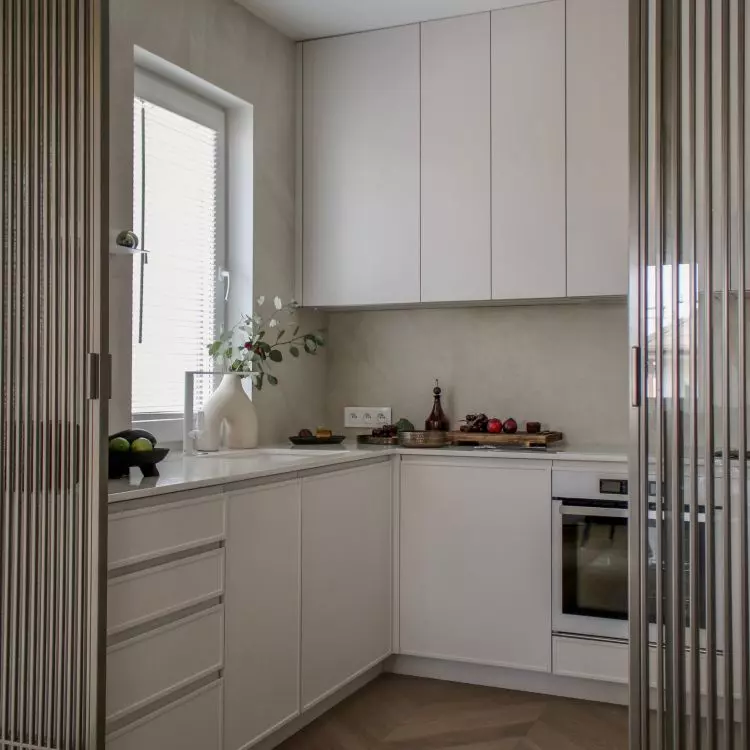 The kitchen was separated from the living room by an openwork wall