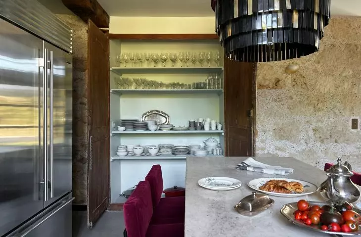 The kitchen has been decorated in such a way that it can be a place to meet with friends and family