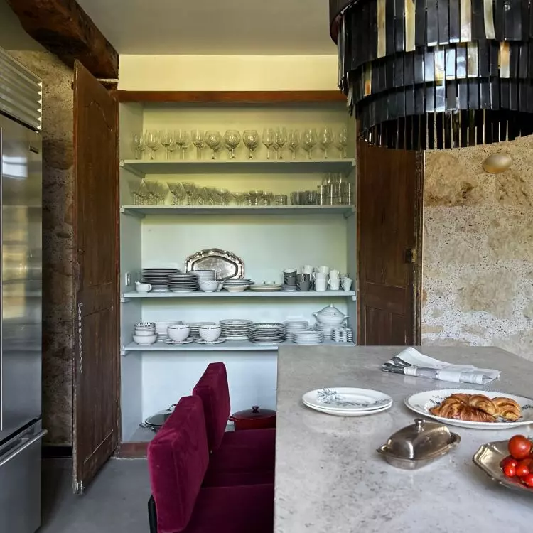 The kitchen has been decorated in such a way that it can be a place to meet with friends and family
