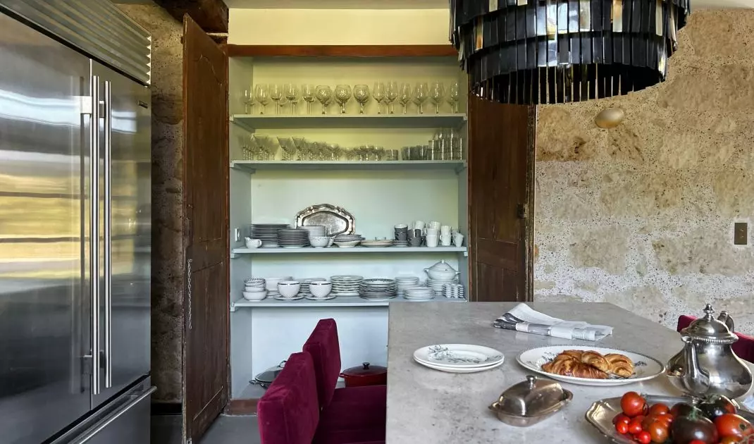 The kitchen has been decorated in such a way that it can be a place to meet with friends and family