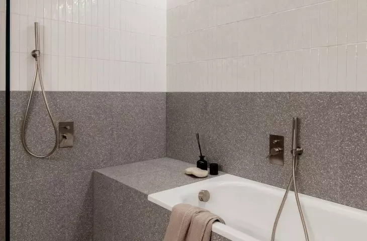 The bathroom has both a shower and a bathtub