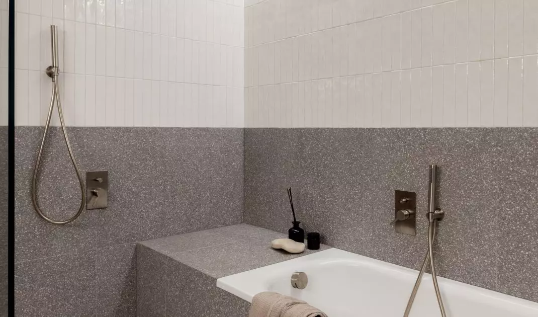 The bathroom has both a shower and a bathtub