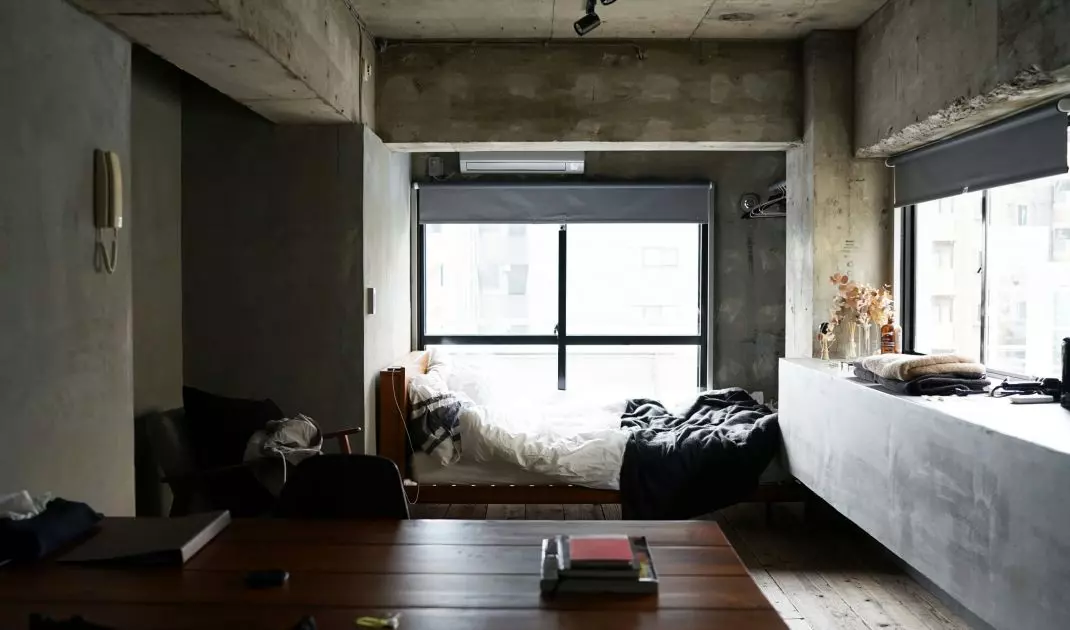 Concrete on the walls will be the perfect backdrop for a minimalist bedroom
