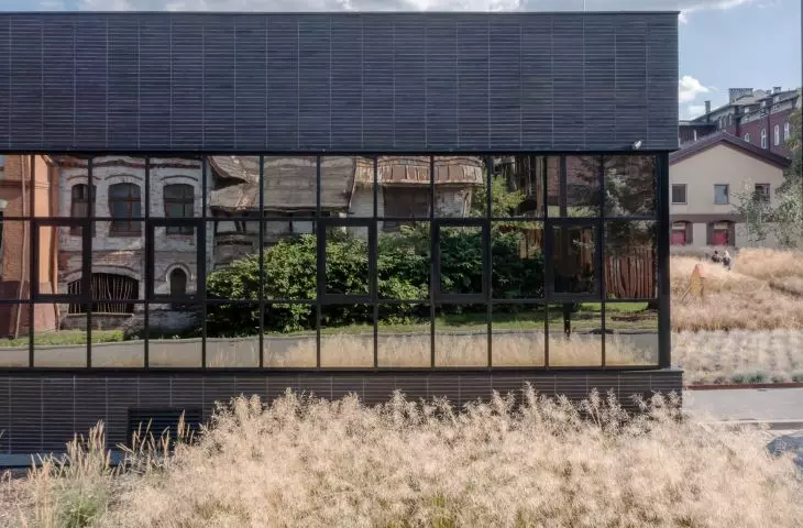 A glazed portion of the facade that reflects the surroundings