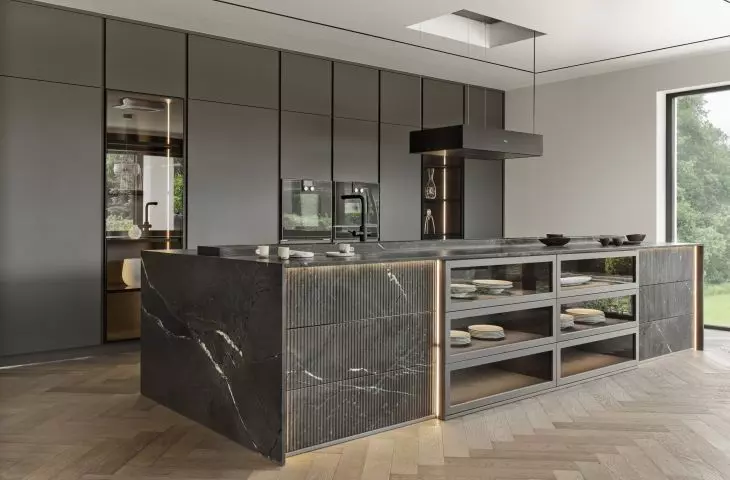 The arrangement uses dark colors and intriguing materials