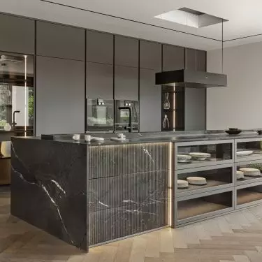 The arrangement uses dark colors and intriguing materials
