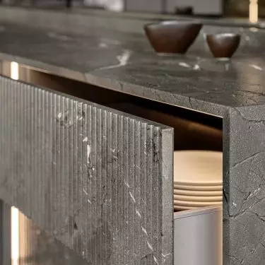 Drawers on the island are distinguished by fluted fronts
