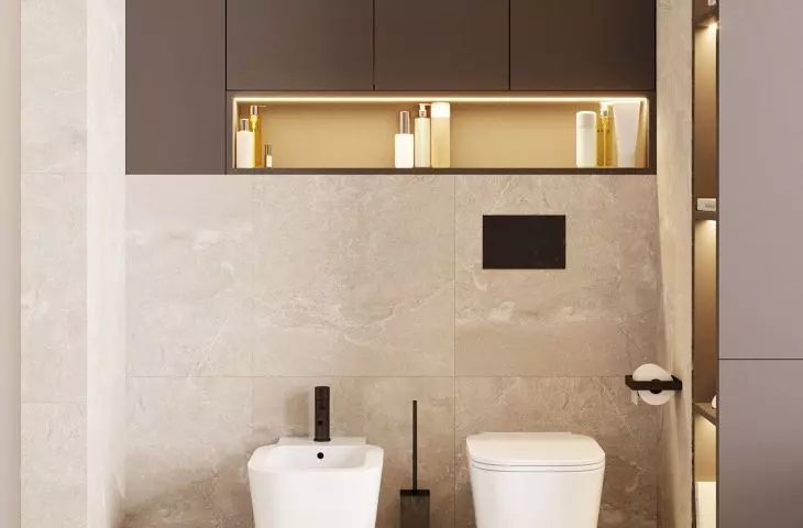 The toilet area has been finished with bright tiles