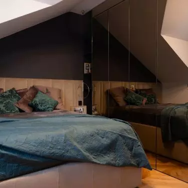The bedroom is located in the attic