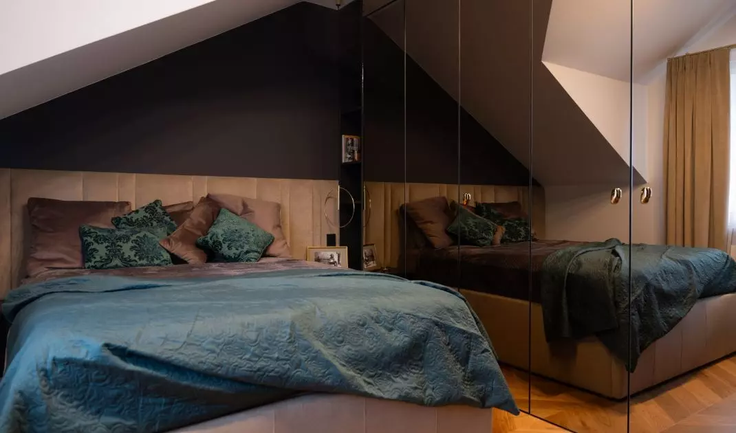 The bedroom is located in the attic